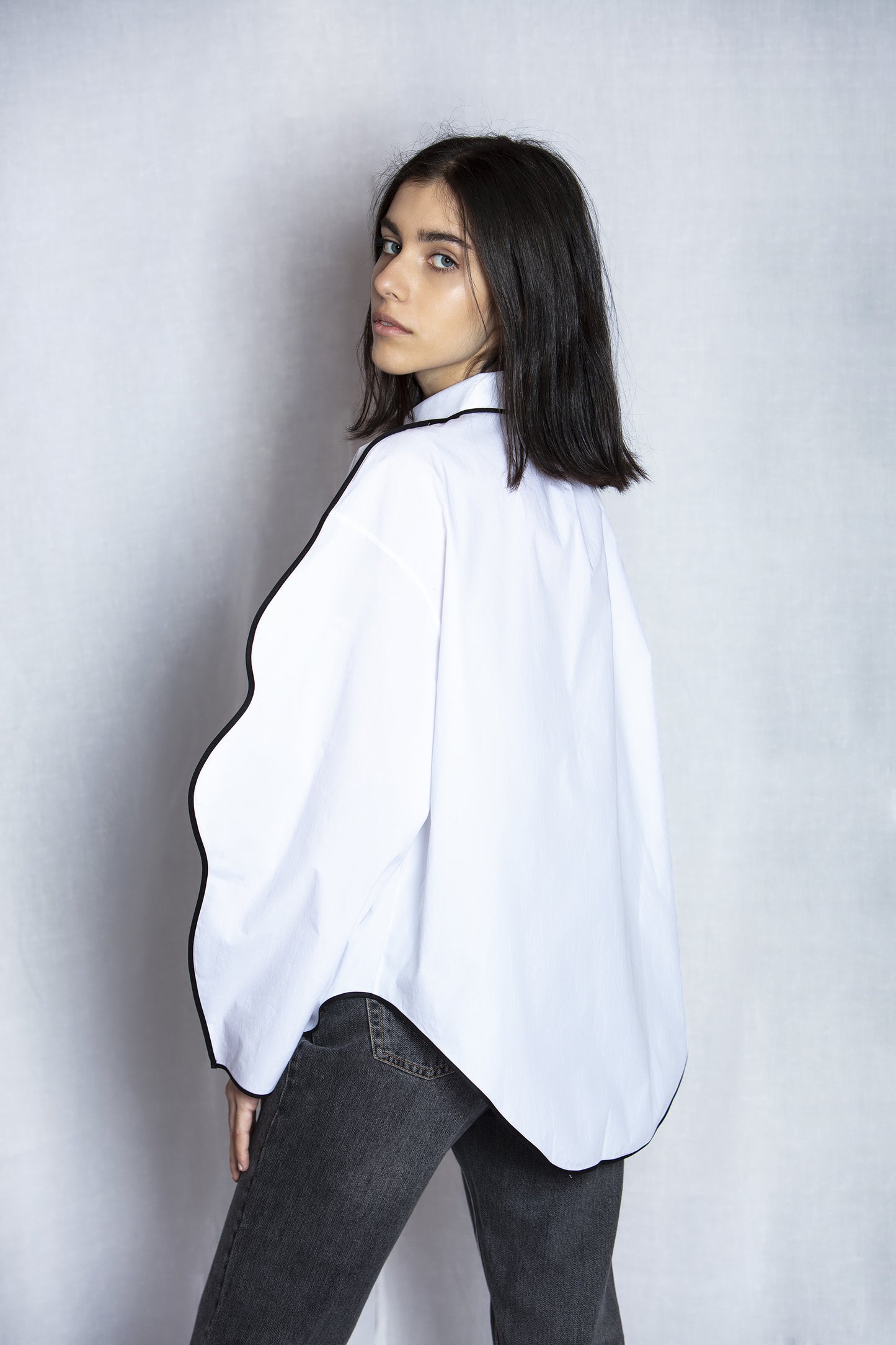 Model wearing AO Wave Shirt side view