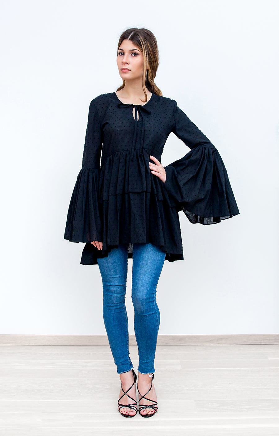 Model Wearing Black Ruffled Top