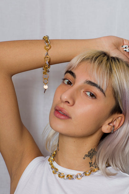 Model presenting IK Plated Gold Silver Chain Set