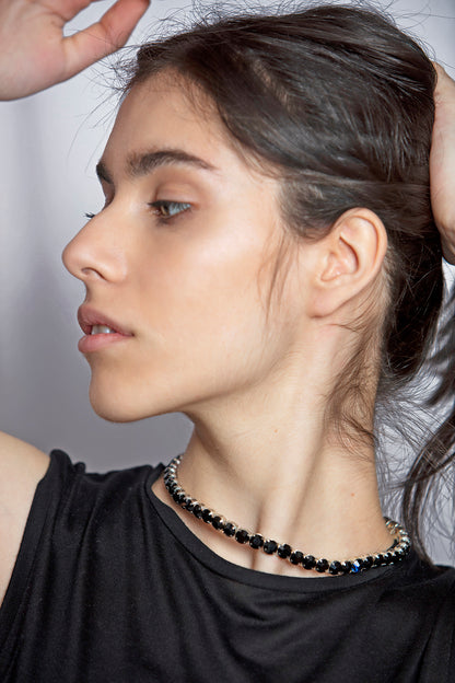 INGA KAZUMYAN'S choker necklace is strung with black Swarovski crystals
