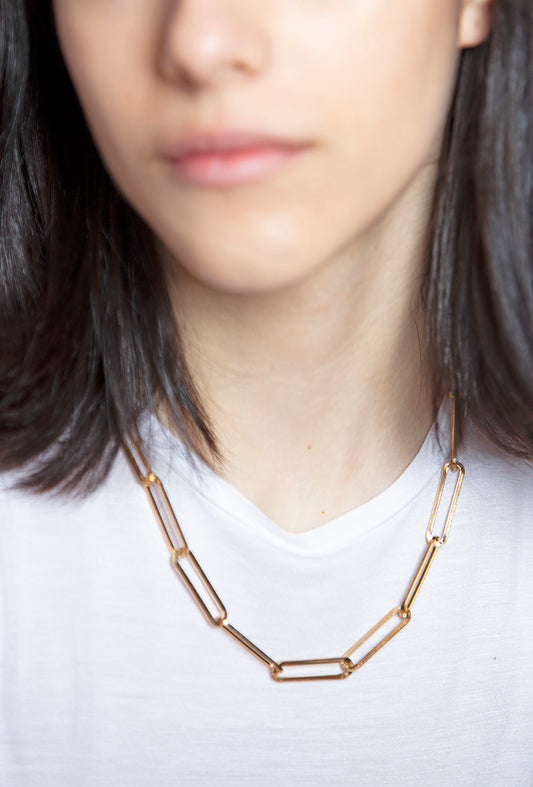 necklace is hand strung from elongated gold-tone simple chain