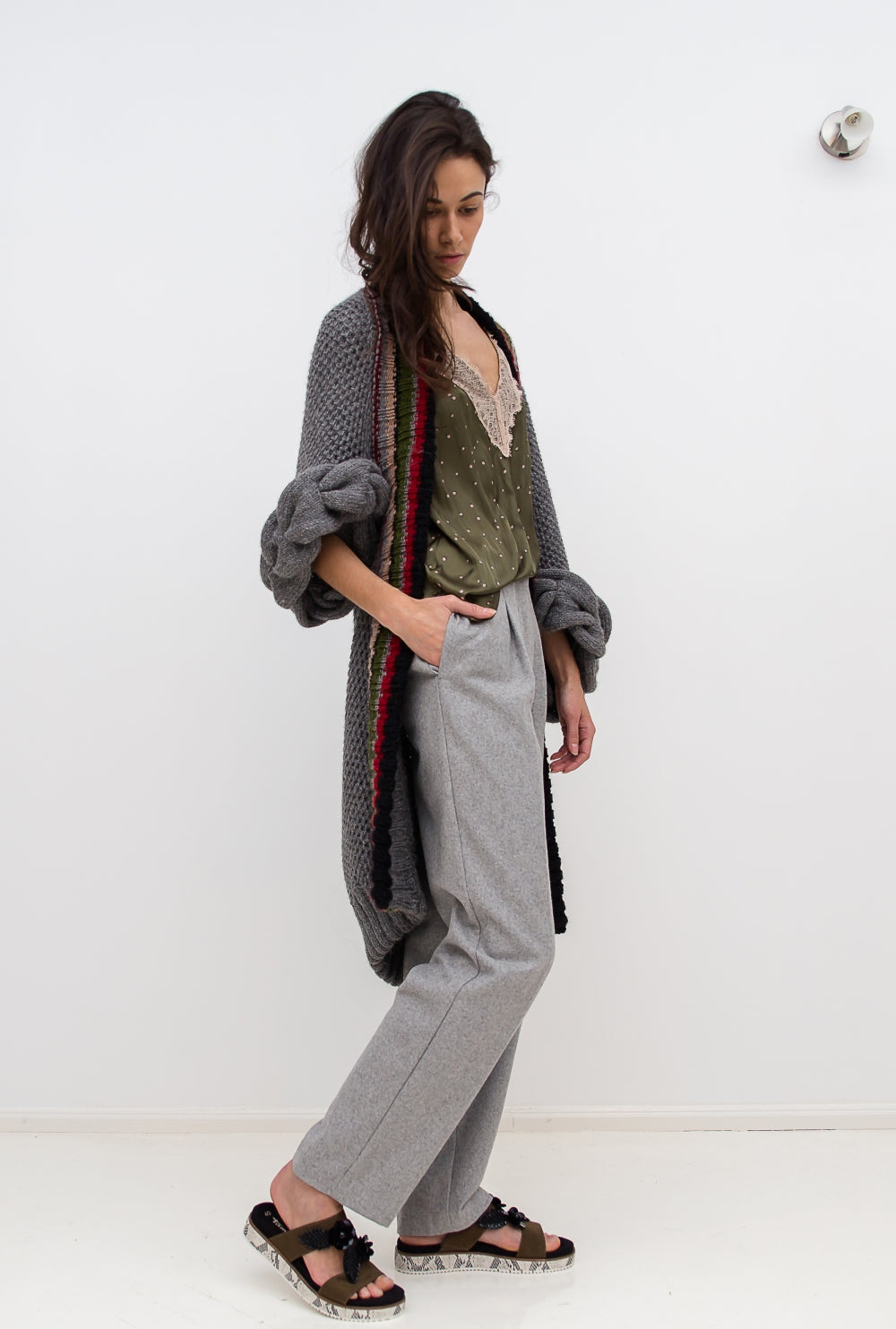Knitted grey cardigan  with braids side view